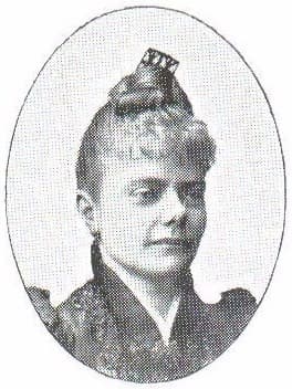 A black and white portrait of a woman with her hair styled up, wearing a high-collared dress.